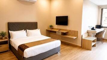 Junior Suite, City View | In-room safe, blackout drapes, iron/ironing board, free WiFi