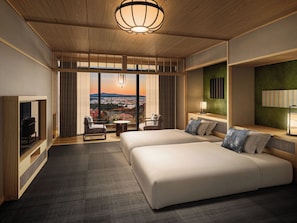 A hotel room with a large window, two beds, a TV, and a view of the cityscape. - ARIMA ONSEN WARAYA JINSEN (Kobe)