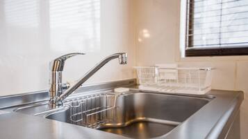 Fridge, microwave, cookware/dishes/utensils