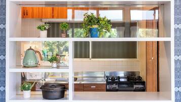 Fridge, microwave, stovetop, cookware/dishes/utensils