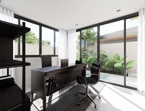 A modern office space with a desk, chair, and large windows. - Pandawa Quarters Residence (Kuta Selatan)