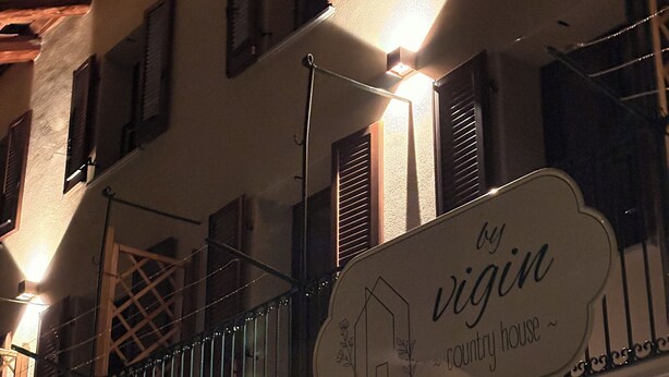 A building with a balcony, a sign reading 'by Vigin country house,' and a decorative railing. - ByVigin Azalea – Elegance, Relaxation, and a Private Outdoor Jacuzzi (Magliano Alfieri)
