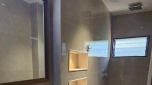 A bathroom with a sink, toilet, and a mirror. - Hotel Santoor - near Geeta bhawan square (Indore)
