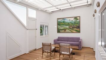 Villa, Garden View | Living area | 55-inch flat-screen TV with satellite channels, fireplace