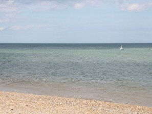 A beach with a pebbly shore and calm sea. - Foreshore (Deal)