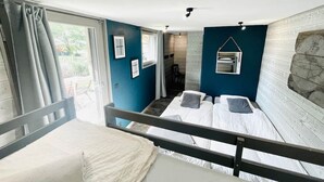 A room with two beds, a window with curtains, a small table, and a wall-mounted shelf. - Chalet 14 pers, jacuzzi, MontBlanc view, 5 bedrooms (Chamonix)
