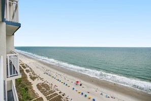 A beach view from a building with a balcony, sandy beach, and ocean. - Oceanfront 2BR - 19th Floor w/ King & 2 Doubles + Breakfast for 2 + Hut Tub (Myrtle Beach)