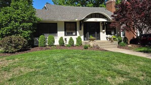 A single-story house with a gabled roof, a front porch, and a mailbox. - Walk to Brookside, Shops/Dining, 3BR, patio, backyard bar.   9 miles 2 World Cup (Kansas City)