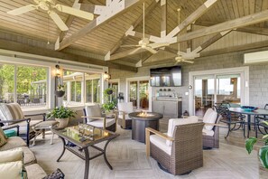 A spacious outdoor living area with seating, a fire pit, and a kitchen area. - Mtn-view Hilltop Home, 5 Mi to Hendersonville (Hendersonville)