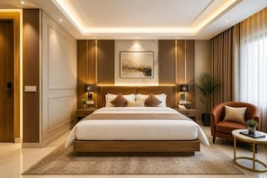 A modern hotel room with a large bed, bedside tables, a red armchair, and a view of the outdoors.