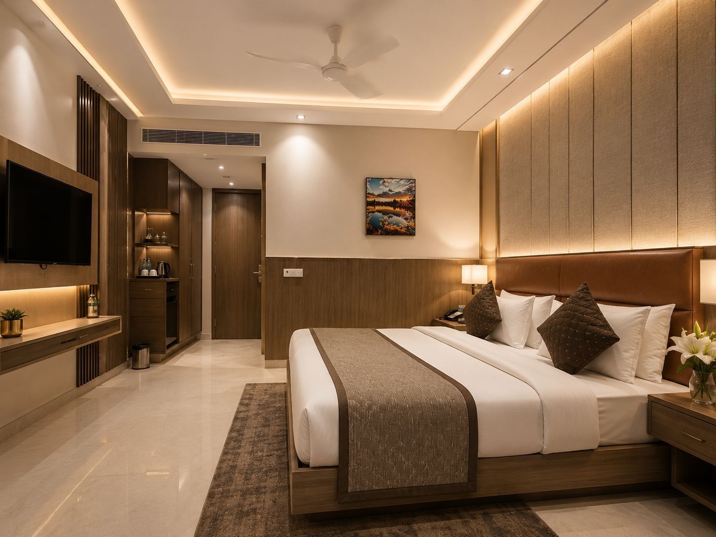 A modern hotel bedroom with a large bed, bedside tables, a flat-screen TV, and a ceiling fan.