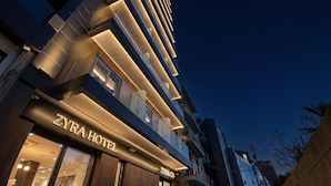 A modern hotel building with a prominent sign reading 'ZYRA HOTEL.' - Zyra Hotel St. Julians (St. Julian's)
