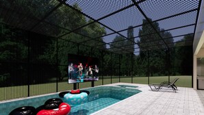 Une piscine intérieure avec des bouées gonflables, une scène et un espace réservé aux spectateurs.