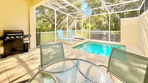 An outdoor patio with a pool, a grill, and lounge chairs. - Private Pool, Balcony & BBQ Area Short Walk to Clubhouse (Clermont)