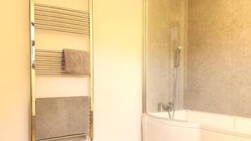 Combined shower/bathtub, deep-soaking bathtub, hair dryer, towels