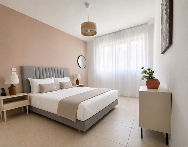A modern bedroom with a bed, bedside tables, a nightstand, a lamp, a mirror, a potted plant, and a painting on the wall.