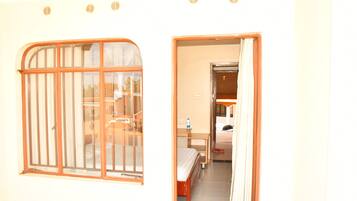 Deluxe Room, Patio, Garden View | Desk, laptop workspace, free WiFi