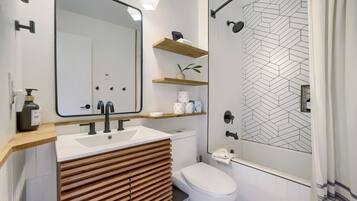 Shower, hair dryer, towels, shampoo