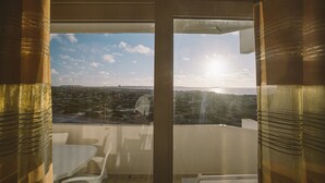 A balcony with a view of the sea and a distant town. - Best Houses 64 - Sunset Beach (Baleal)