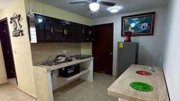 Microwave, stovetop, coffee/tea maker, cookware/dishes/utensils