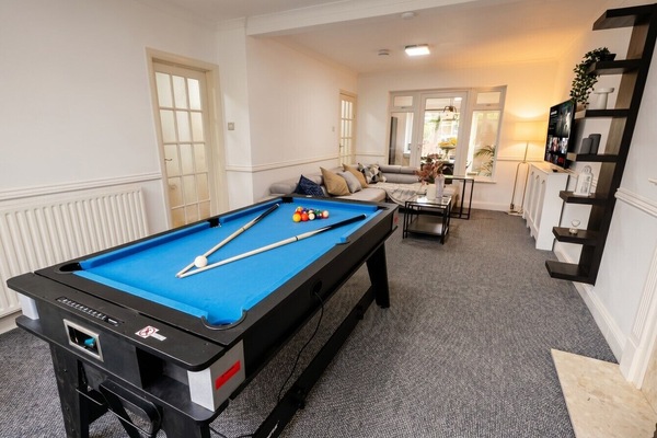 Rack up a game then sink into the sofa in this open-plan games lounge with Netflix.