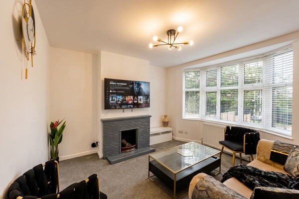 Sink into the stylish lounge with smart TV and feature fireplace for cosy movie nights.