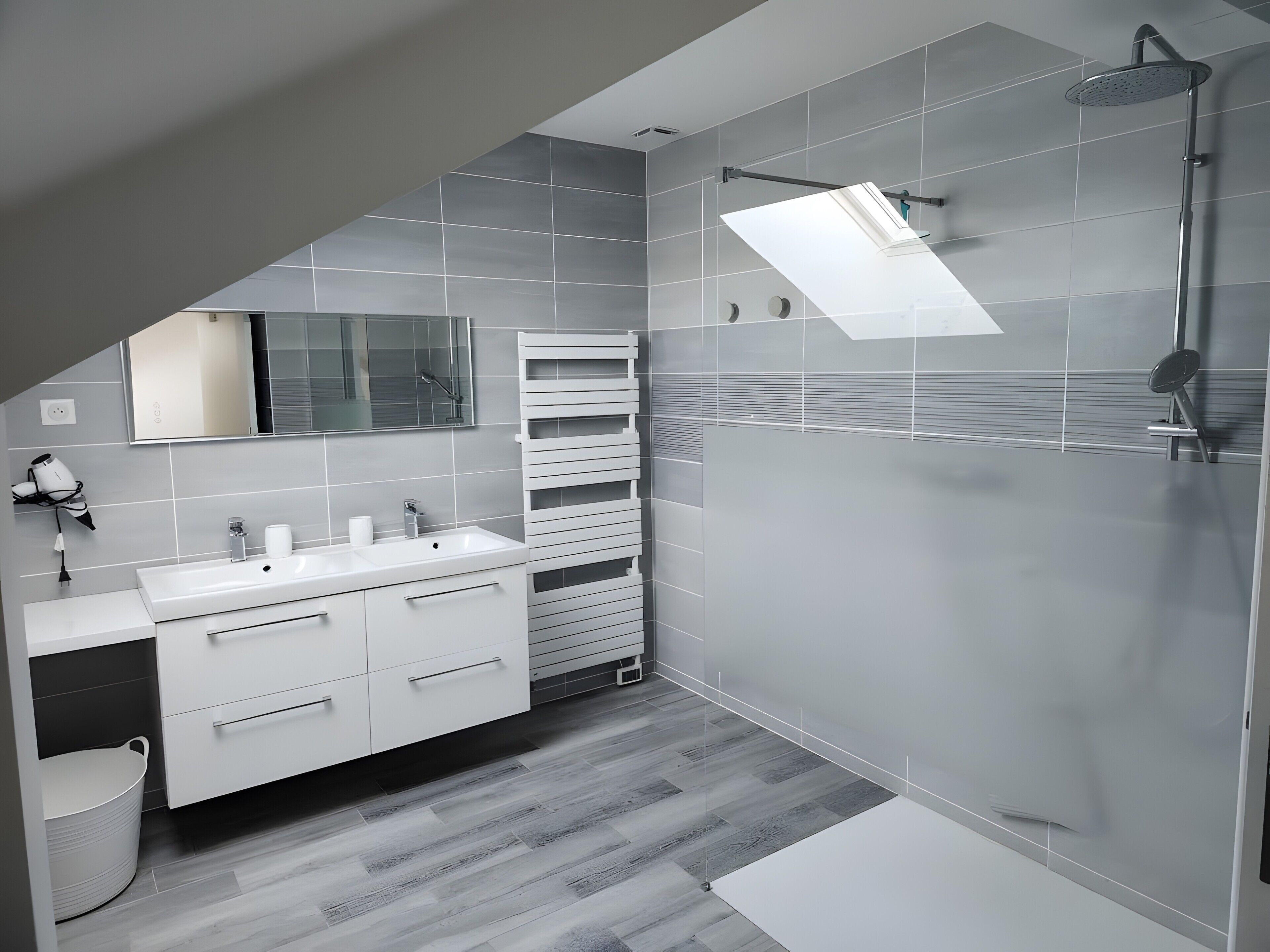A modern bathroom with a shower, a sink, and a mirror.