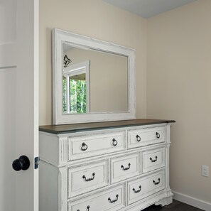 A white dresser with multiple drawers and a mirror above it. - The South Harmony House, Luxury Escape, HotTub, 5,000sqft, Gameroom (Lake Harmony)