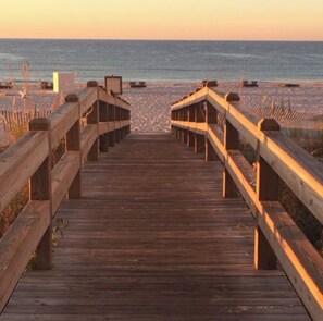 A wooden boardwalk leading to a beach with a clear view of the ocean. - Spacious 2-bedroom beachfront condo in Orange Beach with private jacuzzi tubs (Orange Beach)