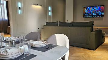 Apartment, 1 Bedroom, City View | Living area | 90-cm Smart TV with cable channels