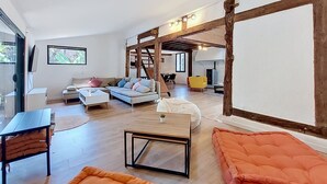 A modern living room with a sofa, a coffee table, and a fireplace. - La landaise by Interhome (Saint-Vincent-de-Tyrosse)