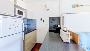 A compact kitchen with a microwave, a toaster, and a sink. - Les Aigues Marines by Interhome (Saint Cyr sur Mer La Madrague)