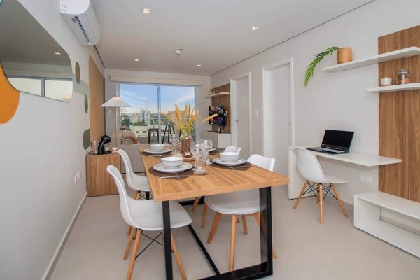 Open dining and living area with balcony