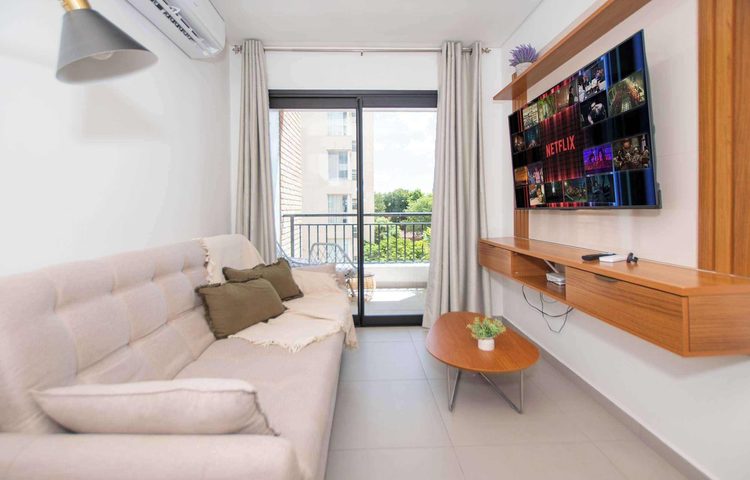 Living room with TV and balcony