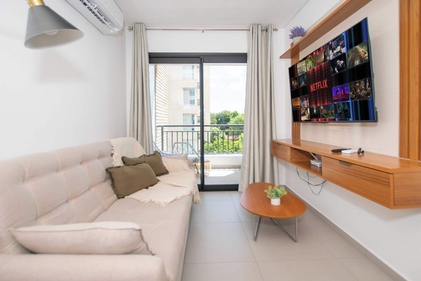 Living room with TV and balcony