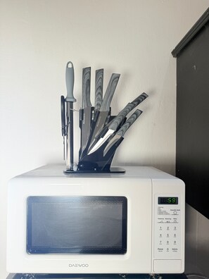 A microwave with a knife holder and a digital display. - 2 minutes walk to the boardwalk and 4 to the beach (Puerto Vallarta)