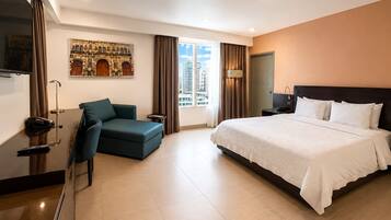 Deluxe Room, City View | In-room safe, desk, soundproofing, iron/ironing board