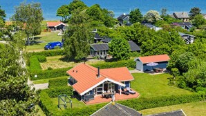 A residential area with houses, a swimming pool, and a view of the sea. - "Ronna" - 160m from the sea by Interhome (Otterup)