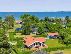 A residential area with houses, a swimming pool, and a view of the sea. - "Ronna" - 160m from the sea by Interhome (Otterup)