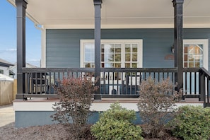 A house with a porch, a window, and a fence. - Charming Midcentury Modern Beltline Home · 3 Mi to Stadium · Sleeps 6 (Atlanta)