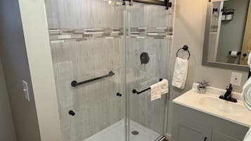 Shower, towels, soap, toilet paper