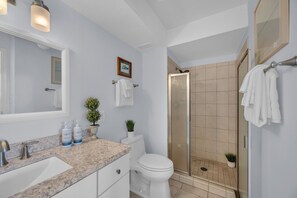A bathroom with a sink, toilet, and shower. - Oceanfront 2 Bedroom Oasis on Sugar Beach (Wailuku)