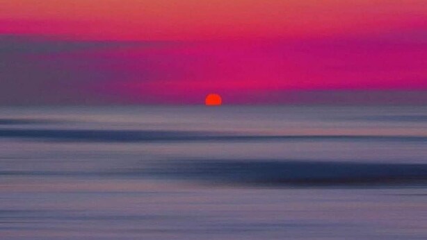 A sunset over a calm body of water. - Reasonable rates (Stellarton)