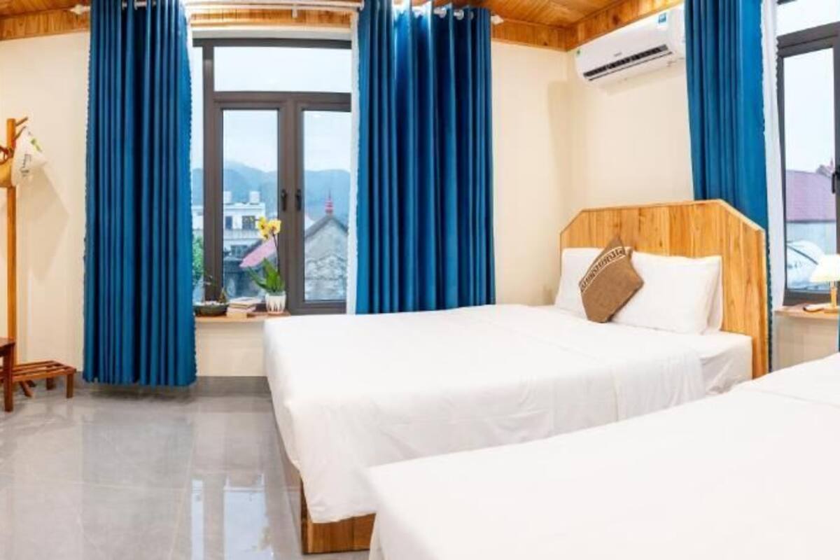 Deluxe Triple Room, Balcony, City View | Desk, blackout drapes, soundproofing, free WiFi