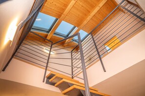 A modern interior with a wooden staircase, metal railings, and skylights. - Da Gregorio: The Lake View Belvedere with Pools (Gignese)