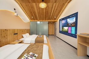A modern hotel room with two beds, a large digital display, wooden ceiling, and a minimalist design.