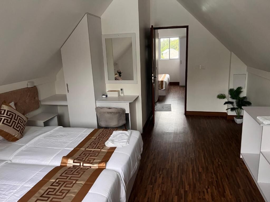 Chambre Quadruple Familiale, balcon, vue partielle sur l'océan | Bureau, espace de travail pour ordinateur portable, Wi-Fi gratuit
