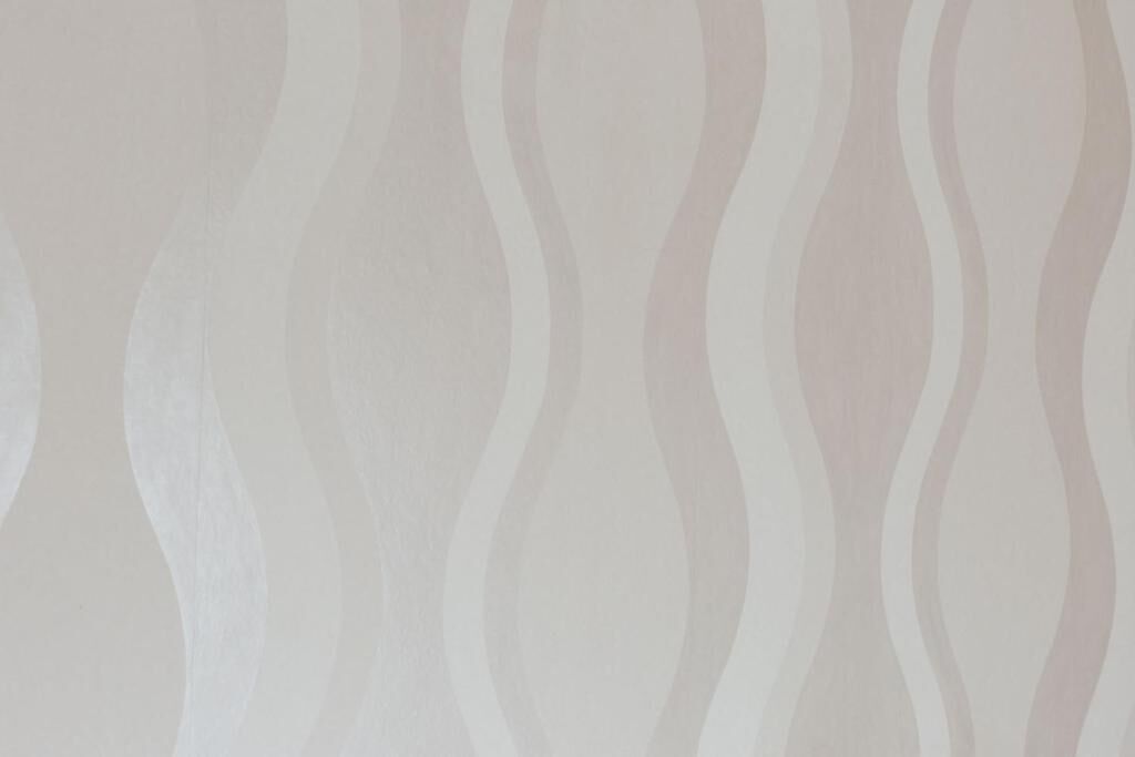 A patterned wallpaper with a wavy design.
