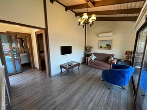 Deluxe Apartment, Balcony, Sea View | Living area