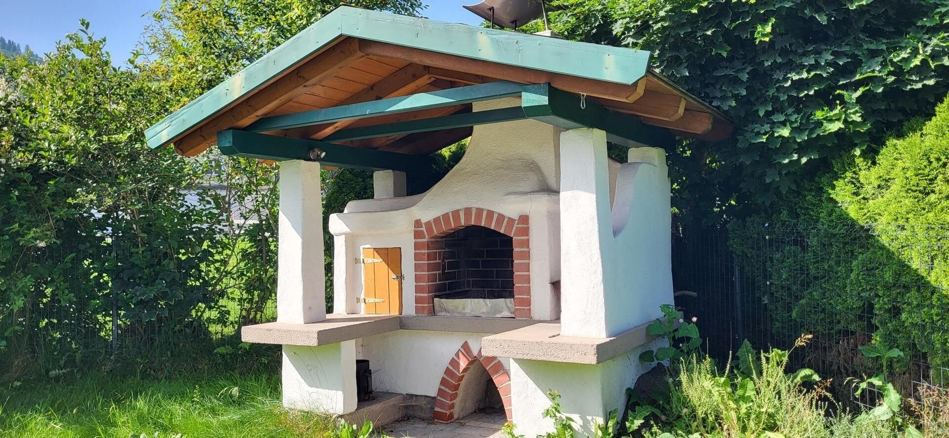 Outdoor area with a large barbecue